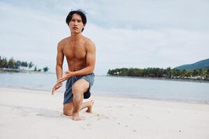 Active Asian Athlete Enjoying a Beach Run. Strength, Freedom, and Serenity photo