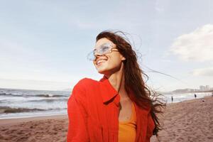 Smiling Woman's Joyful Emotion at Colorful Sunset. Portrait of a Trendy, Carefree Model Enjoying photo