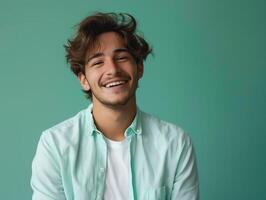 portrait half body confident, good-looking young man smiling brightly in a casual studio shot Ensure he exudes happiness and is isolated against a random color background photo