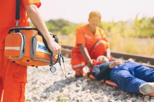 paramedic mobile car medical emergency team working in action help first aid save people life at accident site outdoors photo