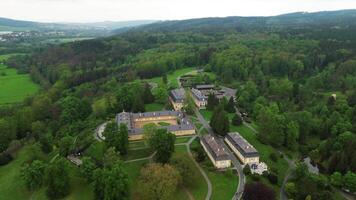 Aerial west orbiting view of chateau Kozel in Czechia video