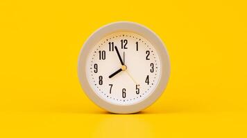 Time and work, the clock stops, the minute hand stops moving, a photo of a clock on a yellow background.