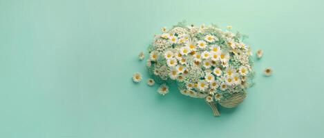 Human brain made of daisies on a green background, concept of neurodiversity and mental problems photo