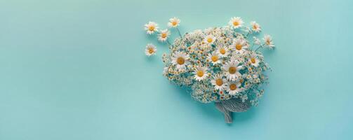 Human brain made of daisies on a blue background, concept of neurodiversity and mental problems photo