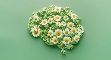 Human brain made of daisies on a green background, concept of neurodiversity and mental problems photo