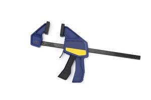 Modern bar clamp with quick release. Carpenters and joiners one handed spring lever quick release clamp for temporary holding of wood and objects in the shop and on site photo