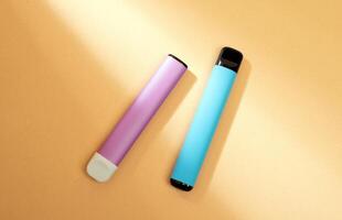 disposable electronic cigarettes with shadow on a beige background with copy space. The concept of modern smoking, vaping and nicotine. photo