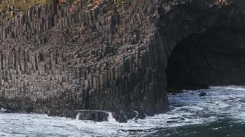 Aerial view of the Rynisfjara black sand beach in Iceland. Black sand beach and Reynisdrangar stack rocks of Vik i myrdal, Iceland. Famous basalt rocks on black sand beach near Vik video