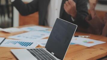Financial analysts analyze business financial reports on a digital tablet planning investment project during a discussion at a meeting of corporate showing the results of their successful teamwork. video