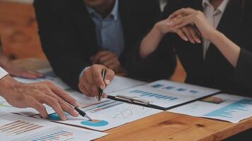 Financial analysts analyze business financial reports on a digital tablet planning investment project during a discussion at a meeting of corporate showing the results of their successful teamwork. video