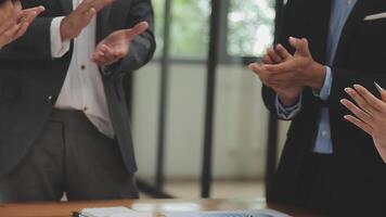 Financial analysts analyze business financial reports on a digital tablet planning investment project during a discussion at a meeting of corporate showing the results of their successful teamwork. video