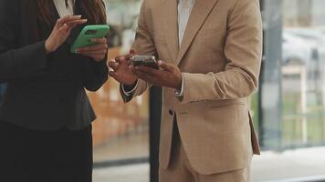 Financial analysts analyze business financial reports on a digital tablet planning investment project during a discussion at a meeting of corporate showing the results of their successful teamwork. video