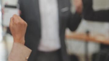 Financial analysts analyze business financial reports on a digital tablet planning investment project during a discussion at a meeting of corporate showing the results of their successful teamwork. video