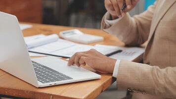 Financial analysts analyze business financial reports on a digital tablet planning investment project during a discussion at a meeting of corporate showing the results of their successful teamwork. video