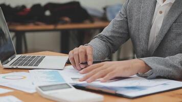 Financial analysts analyze business financial reports on a digital tablet planning investment project during a discussion at a meeting of corporate showing the results of their successful teamwork. video