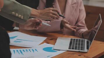 Financial analysts analyze business financial reports on a digital tablet planning investment project during a discussion at a meeting of corporate showing the results of their successful teamwork. video