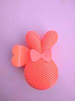 The pink hair clip in the shape of a rabbit looks adorable and beautiful when worn photo