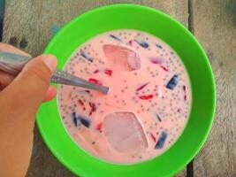 Ice jelly drink is a fresh drink made from pieces of jelly mixed with sweetened condensed milk and sugar water, then served with ice cubes photo