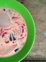 Ice jelly drink is a fresh drink made from pieces of jelly mixed with sweetened condensed milk and sugar water, then served with ice cubes photo