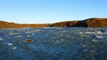 Aerial view of the scenery in Iceland with a waterfall video