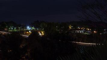 The view of twinkling lights from the many residential houses nestled on hills. photo