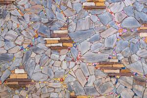 The background wall, which is made from scraps of granite slabs placed together. photo