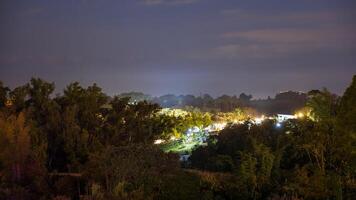 The view of twinkling lights from the many residential houses nestled on hills. photo