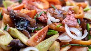 Close-up view of the background of sweet and sour stir-fry, consisting of pork pieces. photo
