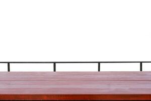 Wooden table top with metallic rail on white background photo