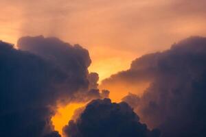 Beautiful dramatic sky and cumulus clouds in the sunset photo