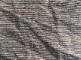 black fabric cloth background. empty space. top view. photo