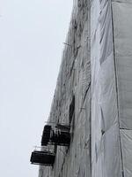 scaffolding and construction site with blue sky background. photo