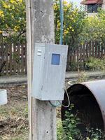 a rusty old telephone box in a park. photo