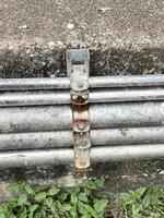 old rusty pipe on the wall photo