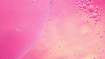Abstract pink colorful background with oil on water surface. Oil drops in water abstract psychedelic, abstract image. photo