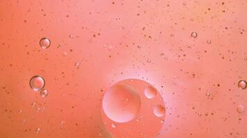 Abstract orange colorful background with oil on water surface. Oil drops in water abstract psychedelic, abstract image. photo