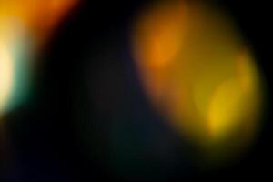 Multicolored highlights on a black background. for overlay to create a festive, vibrant effect photo