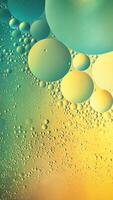 Abstract yellow and green colorful background with oil on water surface. Oil drops in water abstract psychedelic, abstract image. photo