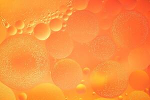 Abstract orange colorful background with oil on water surface. Oil drops in water abstract psychedelic, abstract image. photo