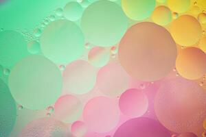 Abstract yellow, green and pink colorful background with oil on water surface. Oil drops in water abstract psychedelic, abstract image. photo