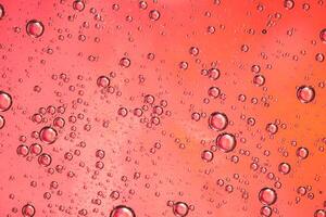 Abstract pink colorful background with oil on water surface. Oil drops in water abstract psychedelic, abstract image. photo
