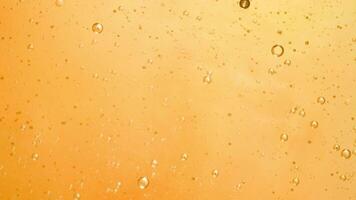 Abstract yellow colorful background with oil on water surface. Oil drops in water abstract psychedelic, abstract image. photo