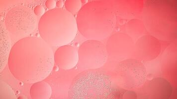 Abstract pink colorful background with oil on water surface. Oil drops in water abstract psychedelic, abstract image. photo