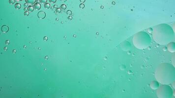 Abstract blue colorful background with oil on water surface. Oil drops in water abstract psychedelic, abstract image. photo