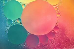 Abstract yellow, green and pink colorful background with oil on water surface. Oil drops in water abstract psychedelic, abstract image. photo