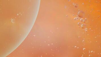 Abstract orange colorful background with oil on water surface. Oil drops in water abstract psychedelic, abstract image. photo