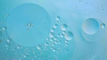 Abstract blue colorful background with oil on water surface. Oil drops in water abstract psychedelic, abstract image. photo