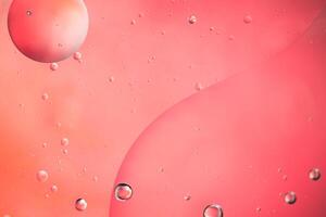 Abstract pink colorful background with oil on water surface. Oil drops in water abstract psychedelic, abstract image. photo