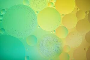 Abstract yellow and green colorful background with oil on water surface. Oil drops in water abstract psychedelic, abstract image. photo