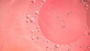 Abstract pink colorful background with oil on water surface. Oil drops in water abstract psychedelic, abstract image. photo